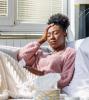 Sick woman on couch