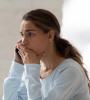 Stressed woman talking on phone
