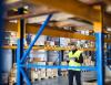 Man taking warehouse inventory