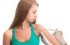 Teen receiving vaccine
