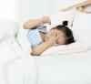 Tired little girl in bed