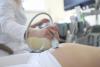 Ultrasound device on pregnant woman's belly