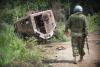 UN soldier with destroyed troop truck