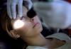Pupil flashlight test on unconscious girl