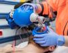 Paramedic using ambu bag on patient