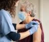 Older woman getting COVID vaccine