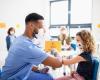 Vaccinator giving young girl elbow bump