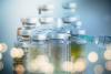 Vaccine vials and syringe