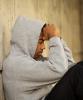 Weary young man wearing hoodie
