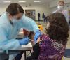 Woman getting COVID vaccine