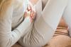 Woman holding stomach