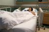 Woman in hospital bed