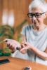 Woman monitoring her blood glucose