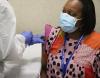 Woman receiving COVID vaccine