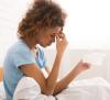 Woman sick in bed