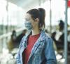 Woman wearing mask in airport
