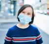 Woman with Down syndrome wearing mask