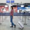 Woman with luggage in airport