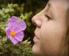 Woman smelling a flower