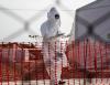 Worker wearing protective equipment at Ebola treatment center