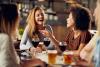 Young adults dining indoors without masks