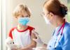 Young boy in mask after vaccination
