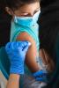 Young girl getting shot in arm