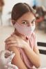 Young girl getting vaccine