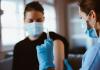 Young woman about to get vaccinated