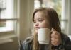 Young woman with Down syndrome with coffee mug