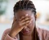 Young woman with long covid headache