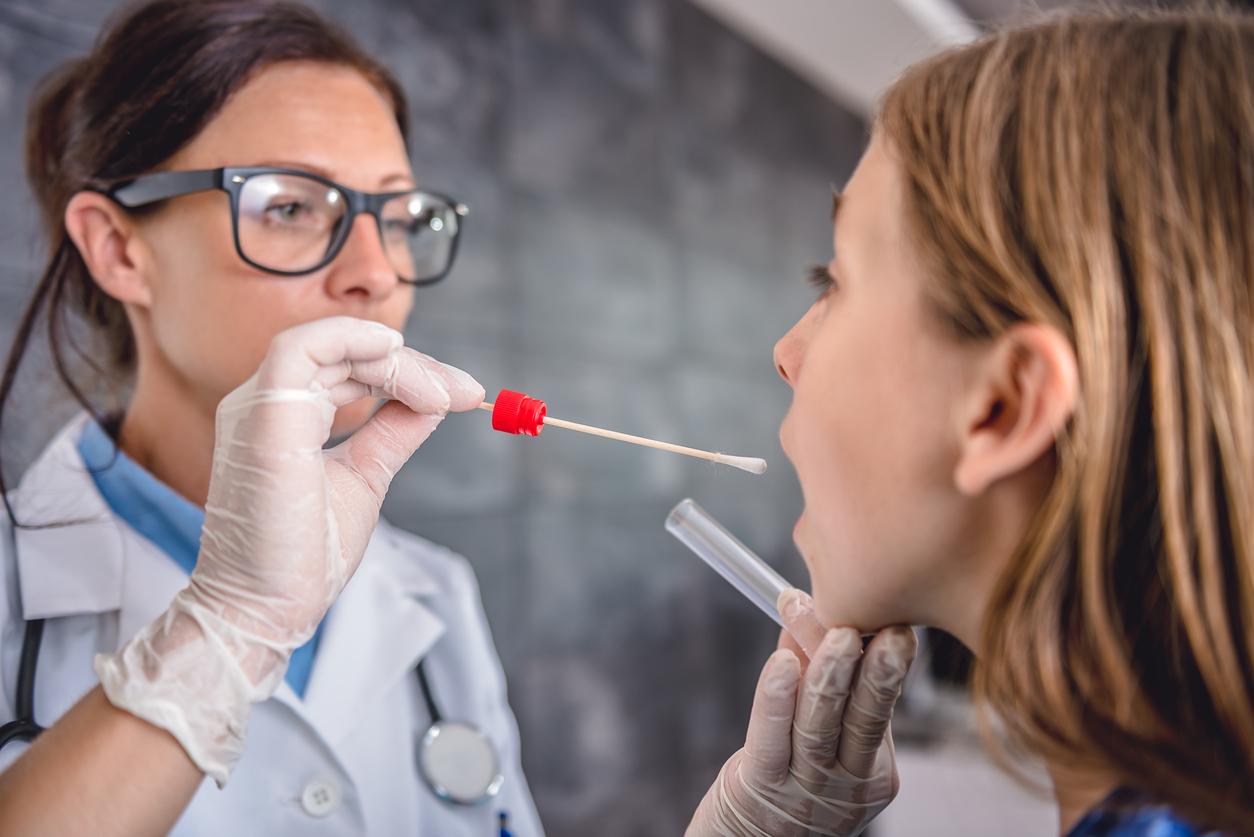 Nurse taking throat culture