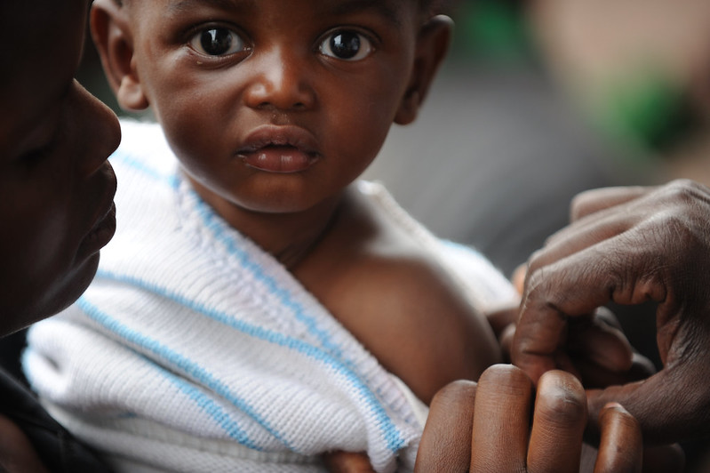 young boy immunized